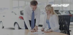 where to sign title when junking a car